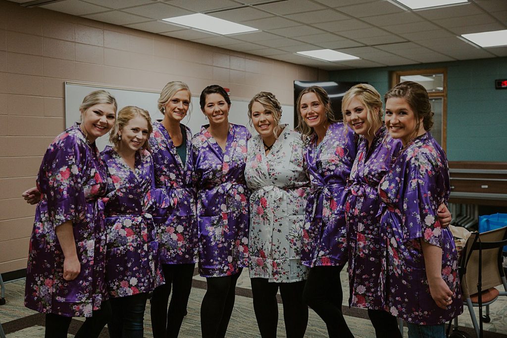 Bridesmaids in purple robes