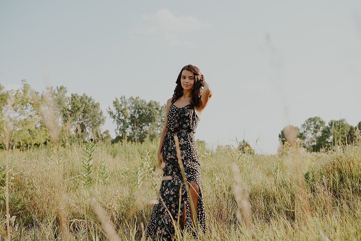 Girl in long dress in field