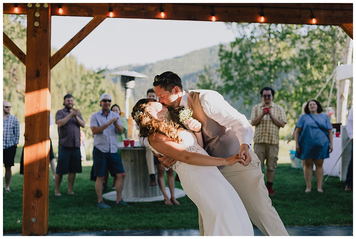 Married couple kiss at Montana reception